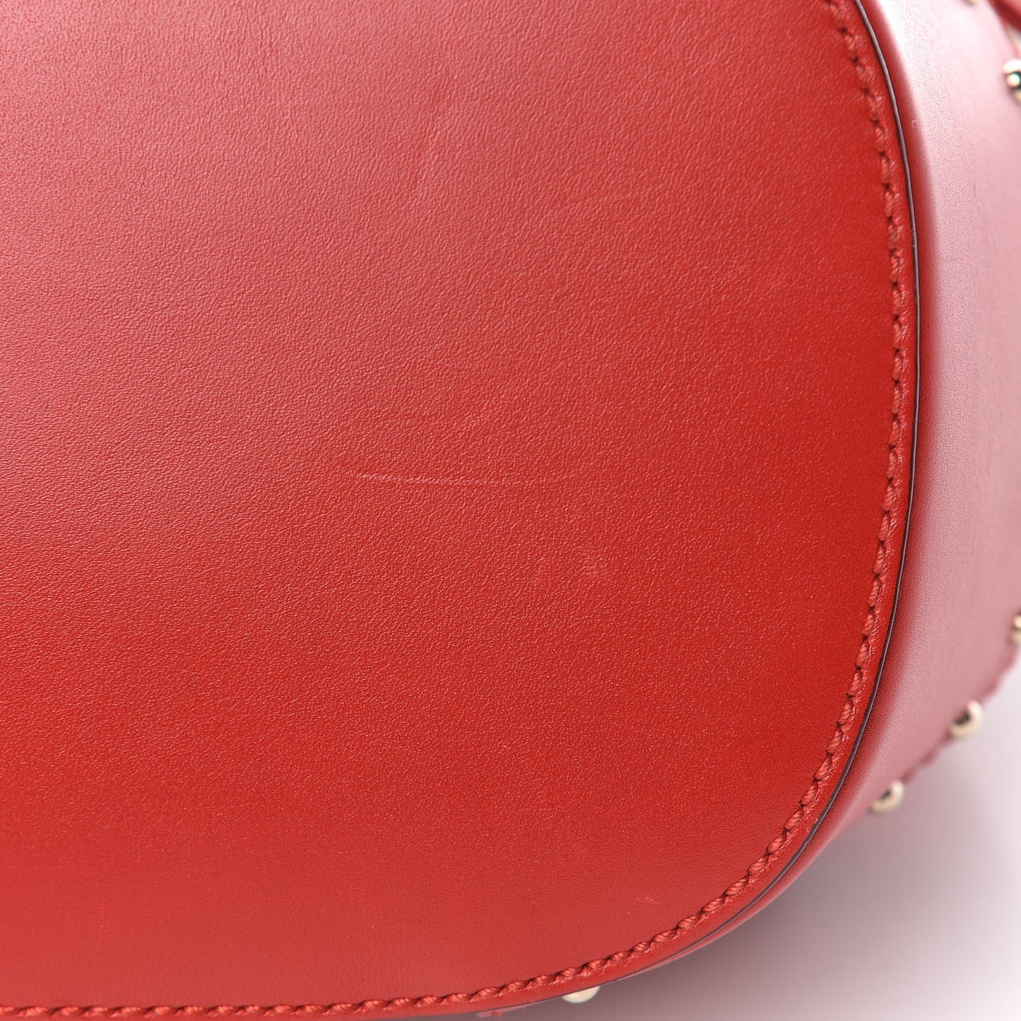 HIlary Lux GG Monogram Embossed Studded Small Bucket Bag Tobasco