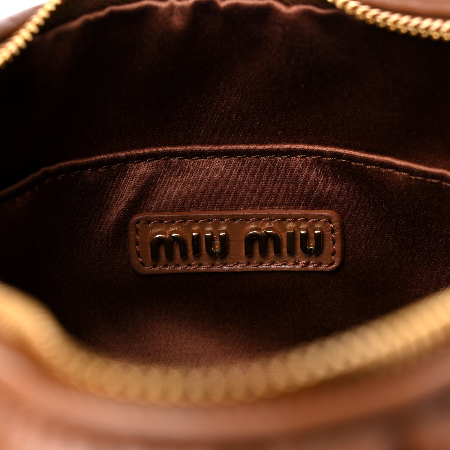 interior image of MIU MIU Nappa Matelasse Wander bag in size Large in the color Cognac by fashionphile