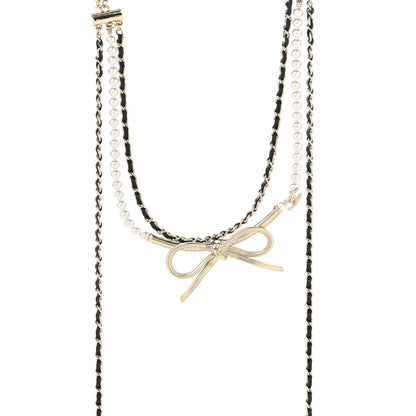 Chanel Calfskin Pearl Metal CC Bow Necklace Gold White Black 1 of 5