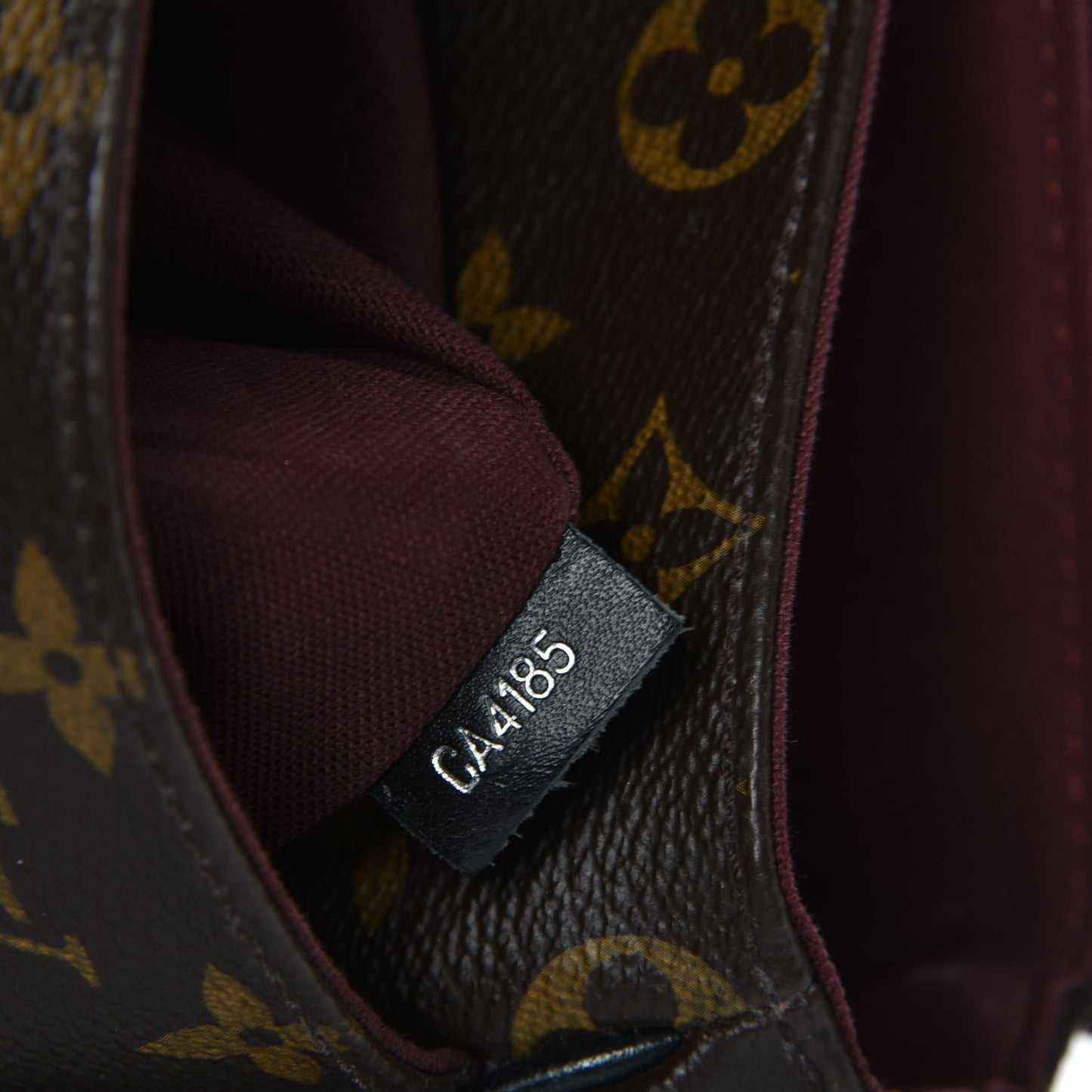 Monogram Macassar District PM