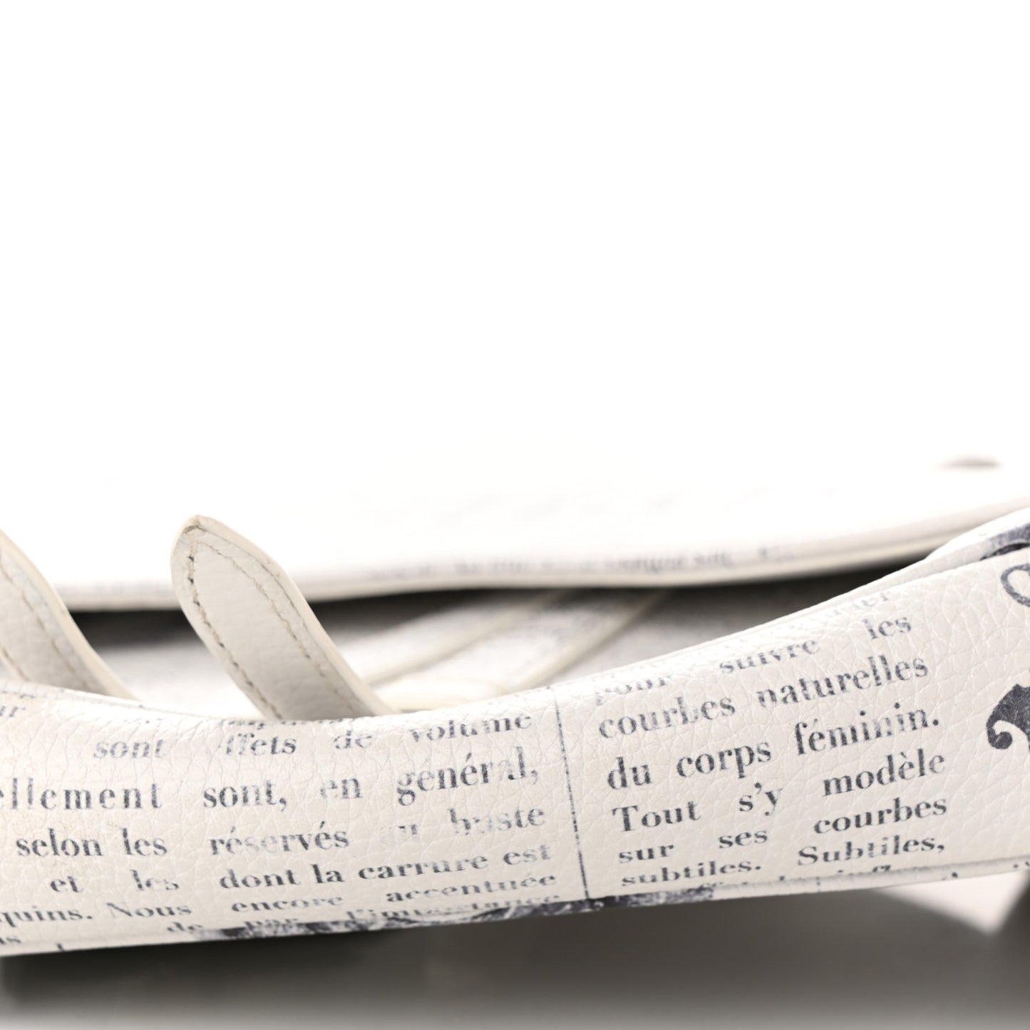 X DANIEL ARSHAM Grained Calfskin Newspaper Print Saddle Bag White