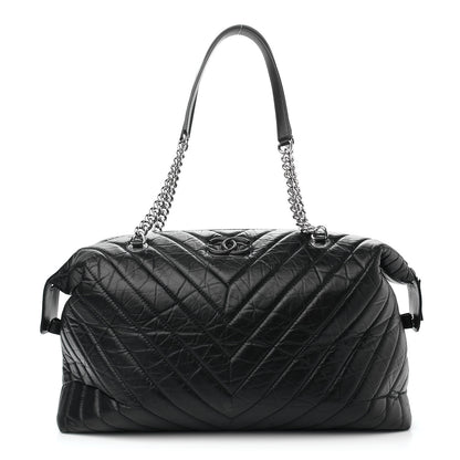 Chanel Aged Calfskin Chevron Quilted Duffle Bag Black 1 of 9