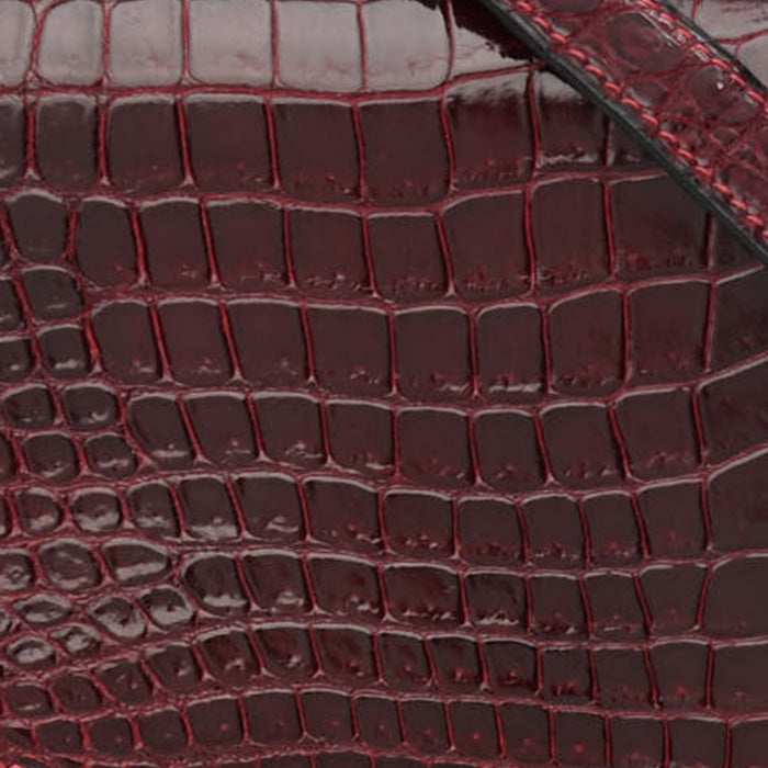 swatch of hermes rouge h in shiny porosus crocodile FASHIONPHILE