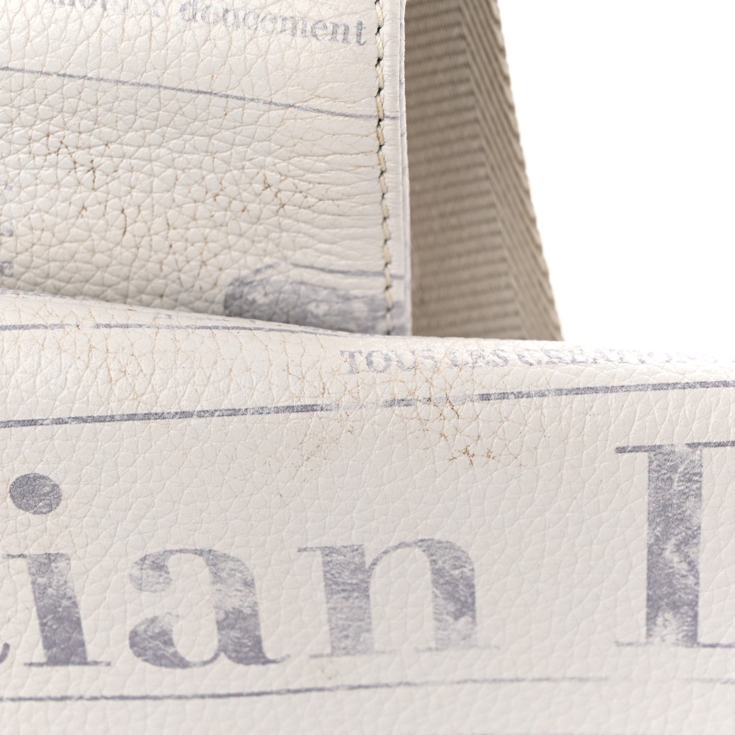X DANIEL ARSHAM Grained Calfskin Newspaper Print Saddle Bag White