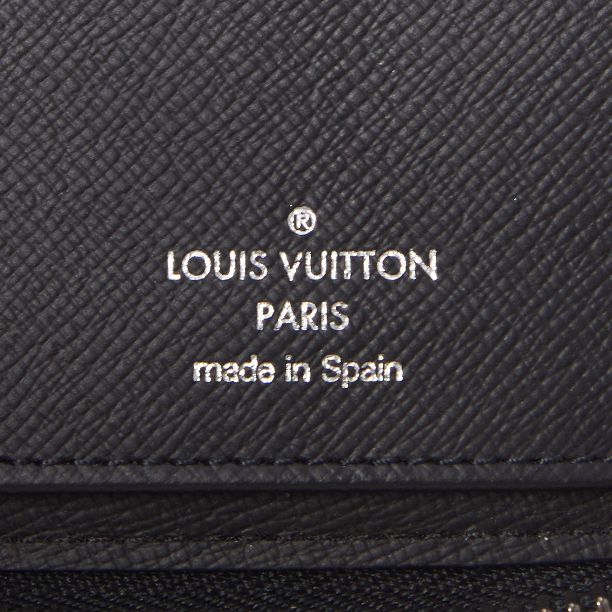 Monogram Eclipse Vertical Zippy Wallet