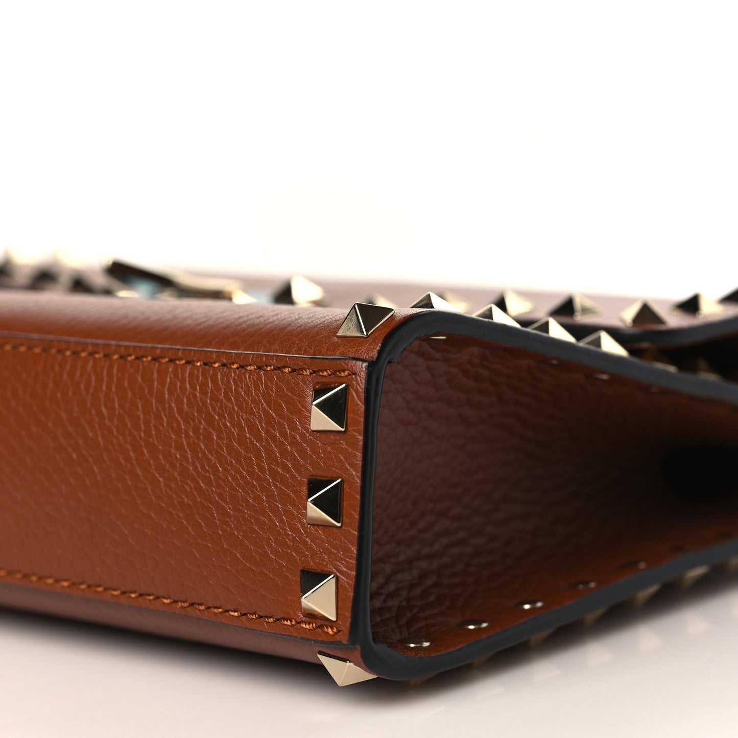 Pebbled Calfskin Medium Rockstud Flip Lock Crossbody Bag Saddle Brown