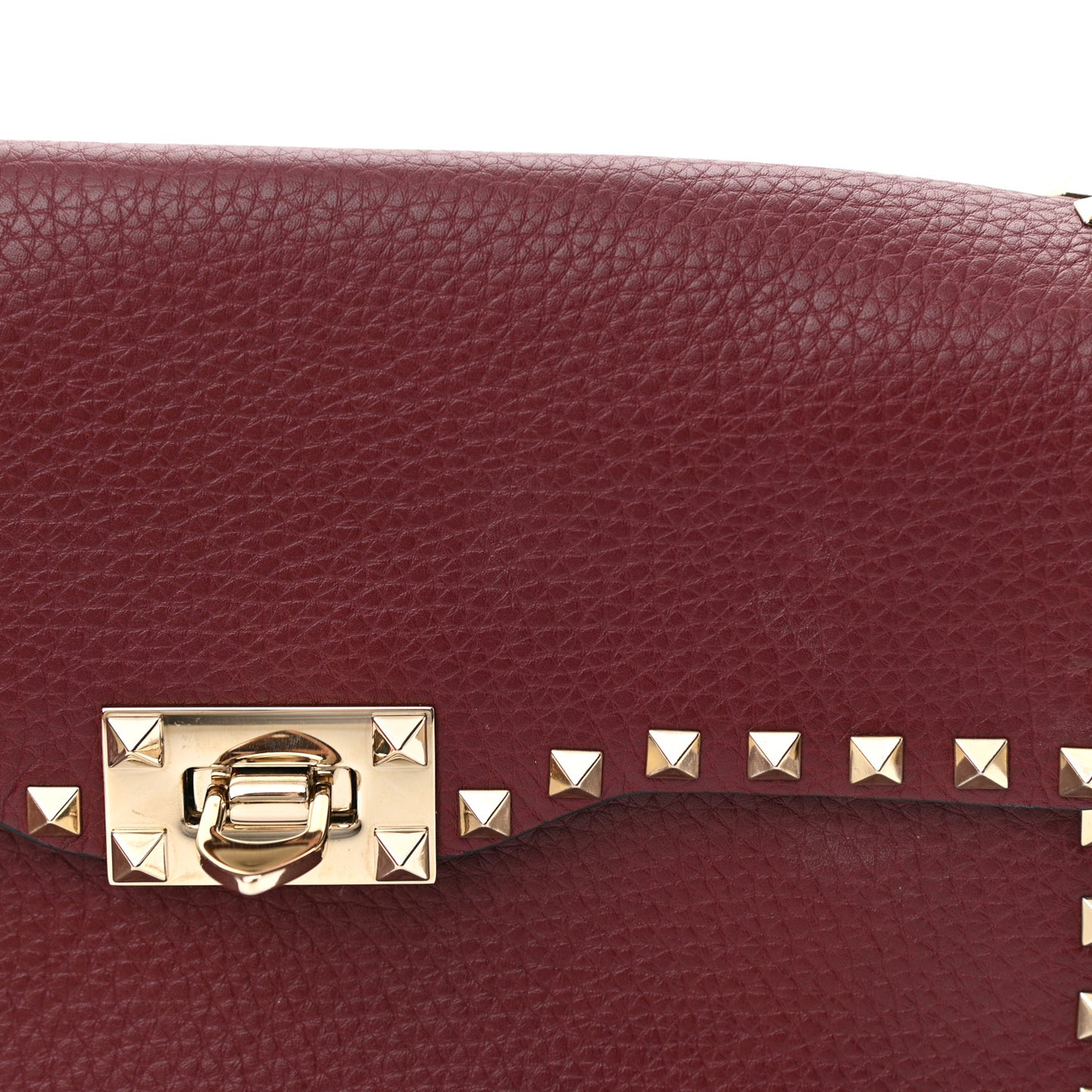Pebbled Calfskin Medium Rockstud Flap Saddle Bag Rubino