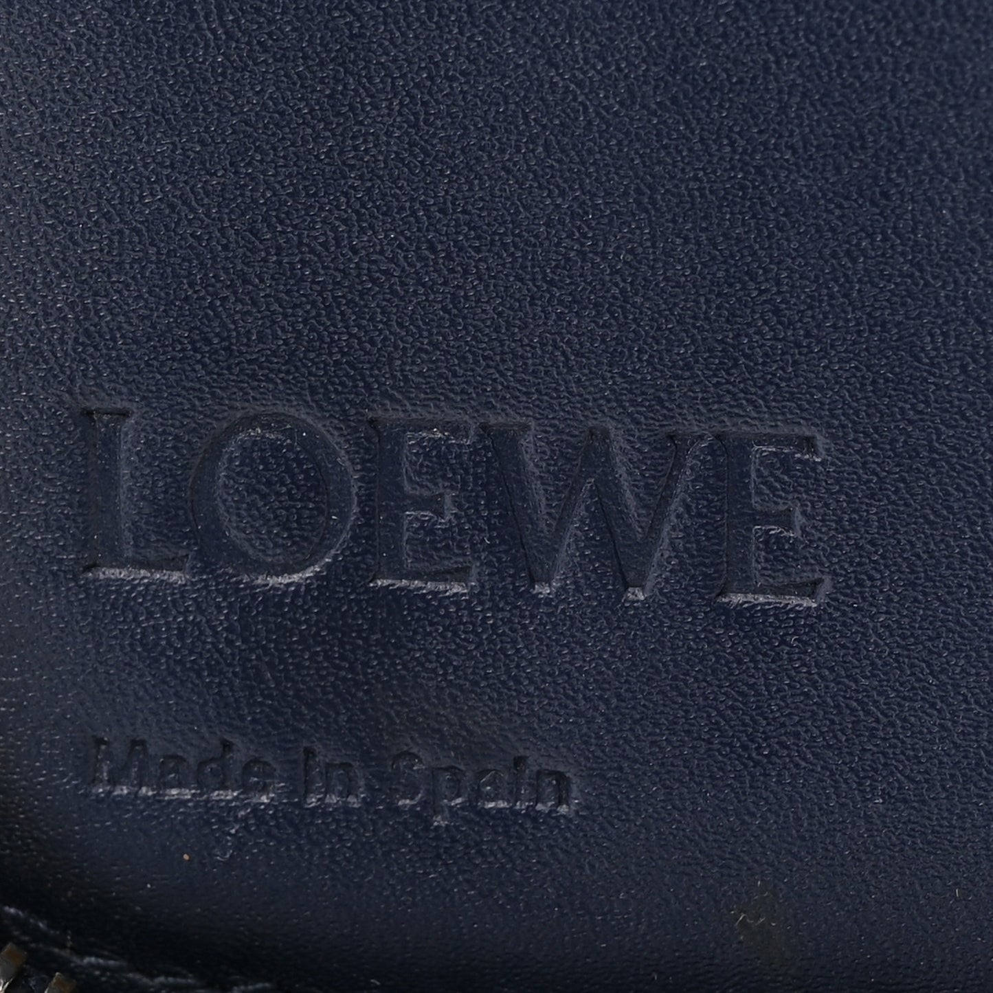 Calfskin Embossed Repeat Puzzle Zip Around Wallet Blue