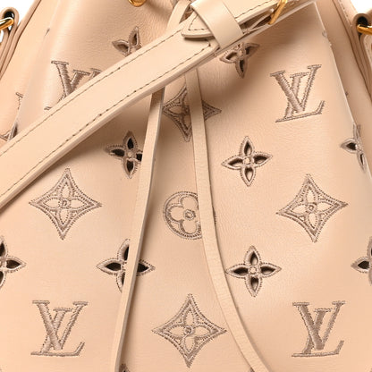 Louis Vuitton Calfskin Monogram Cutout Petit Noe Neutral 7 of 9
