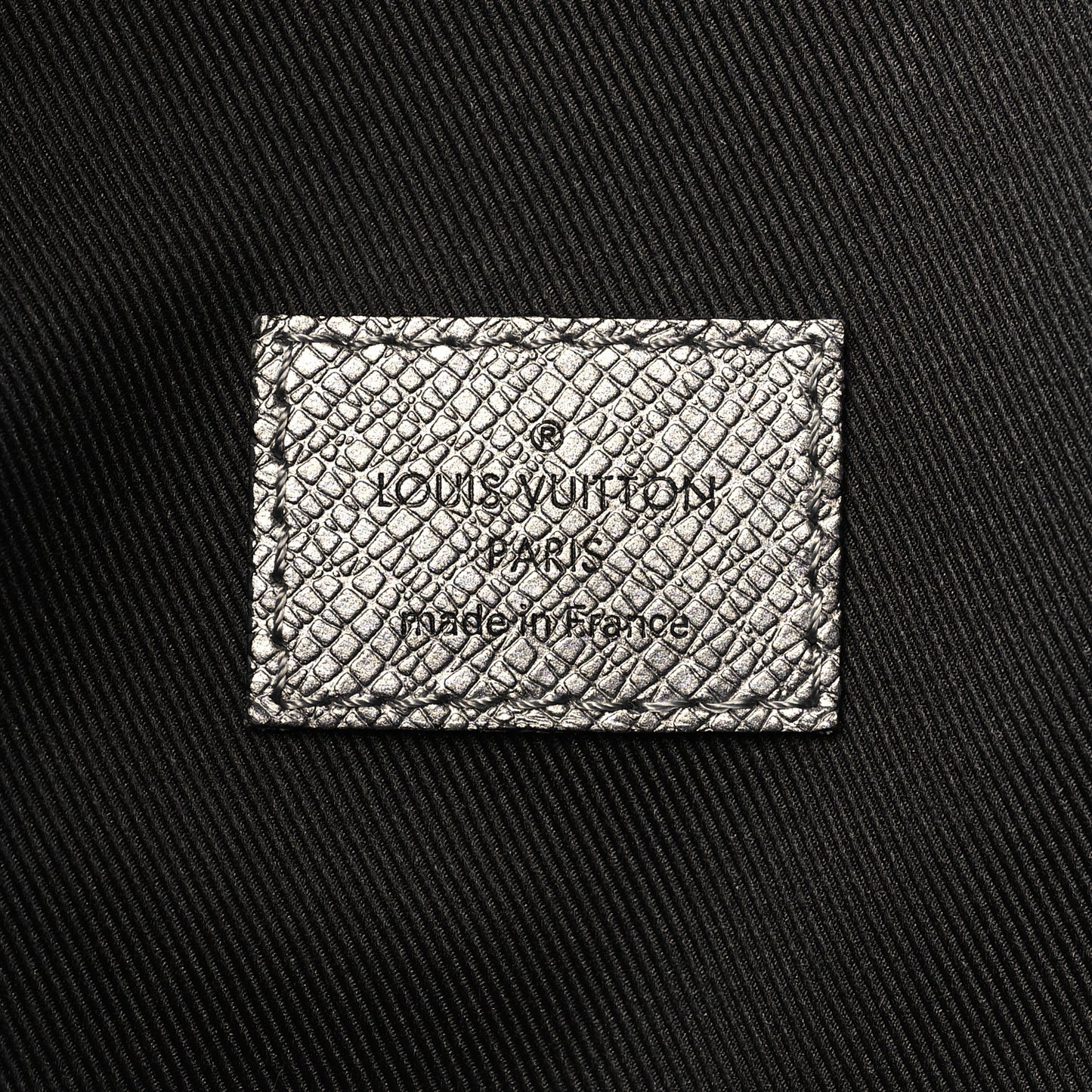 Monogram Taiga Discovery Backpack PM Silver