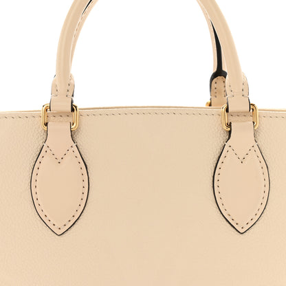 Louis Vuitton Empreinte Monogram Giant Onthego PM Cream Beige 7 of 14