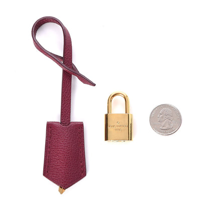Louis Vuitton Veau Cachemire Soft Lockit Clochette Key Bell Holder and Lock Set Griotte 2 of 5