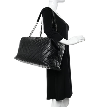 Chanel Aged Calfskin Chevron Quilted Duffle Bag Black 2 of 10