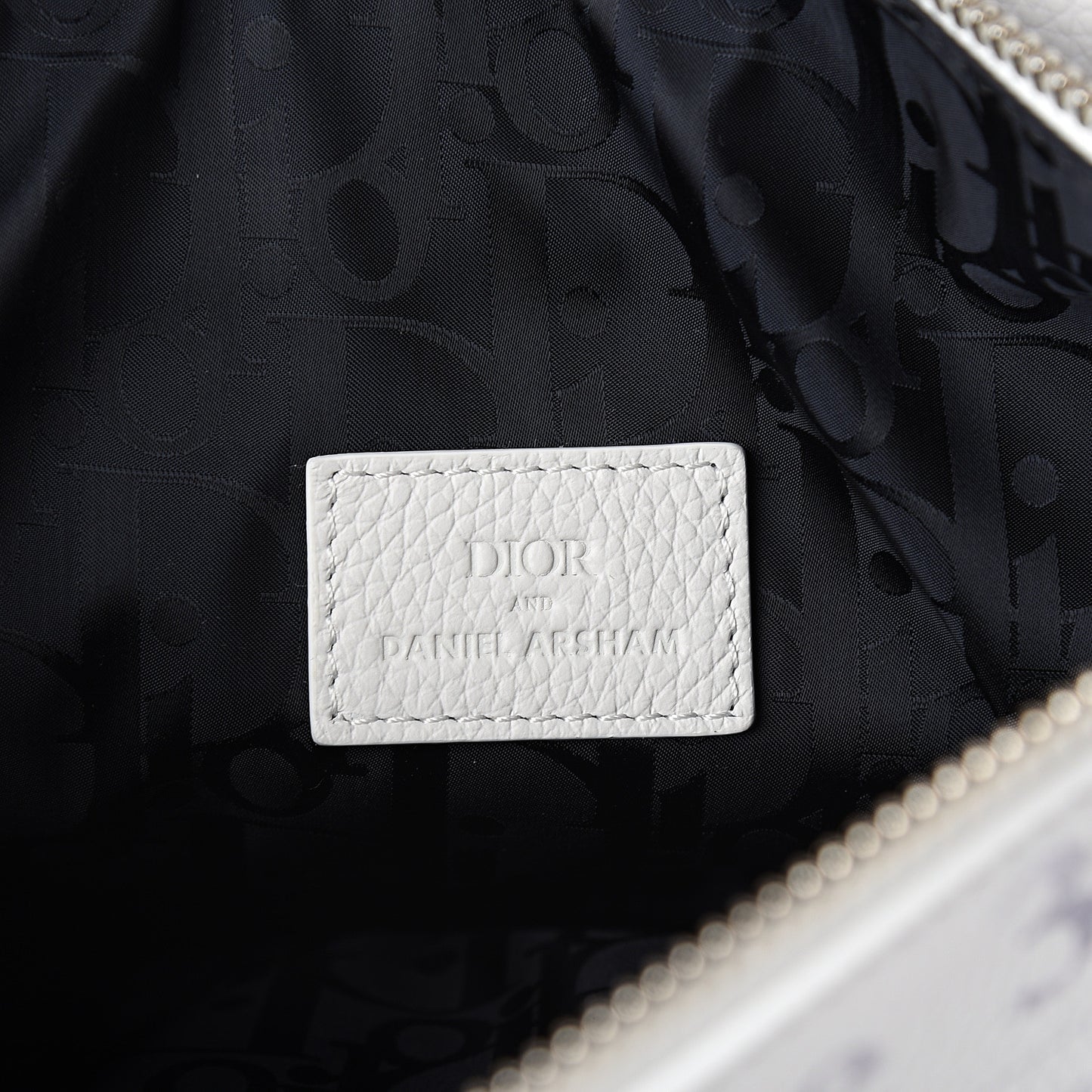 X DANIEL ARSHAM Grained Calfskin Newspaper Print Saddle Bag White
