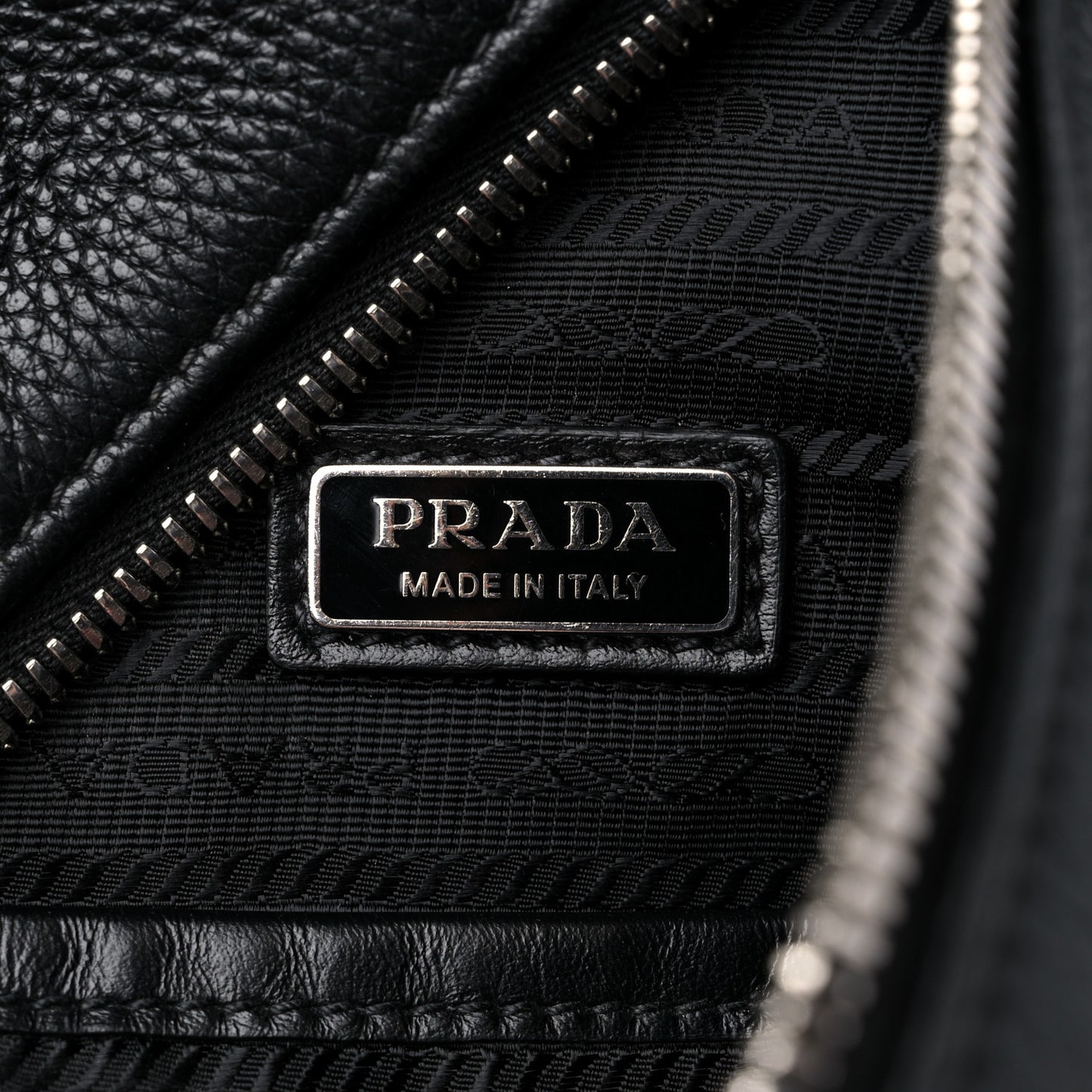 Vitello Daino Logo Embossed Cross Sling Backpack Black