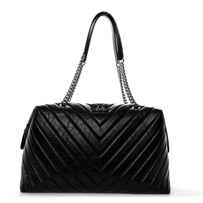 Chanel Aged Calfskin Chevron Quilted Duffle Bag Black 1 of 10