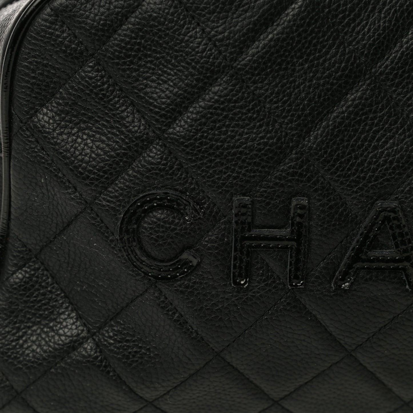 Caviar Patent Quilted Bowler Black