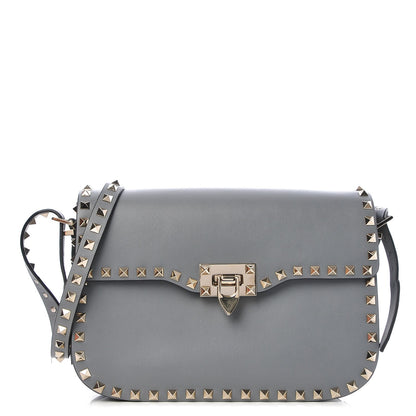 Valentino Garavani Vitello Medium Rockstud Flap Saddle Bag Light Stone 1 of 6