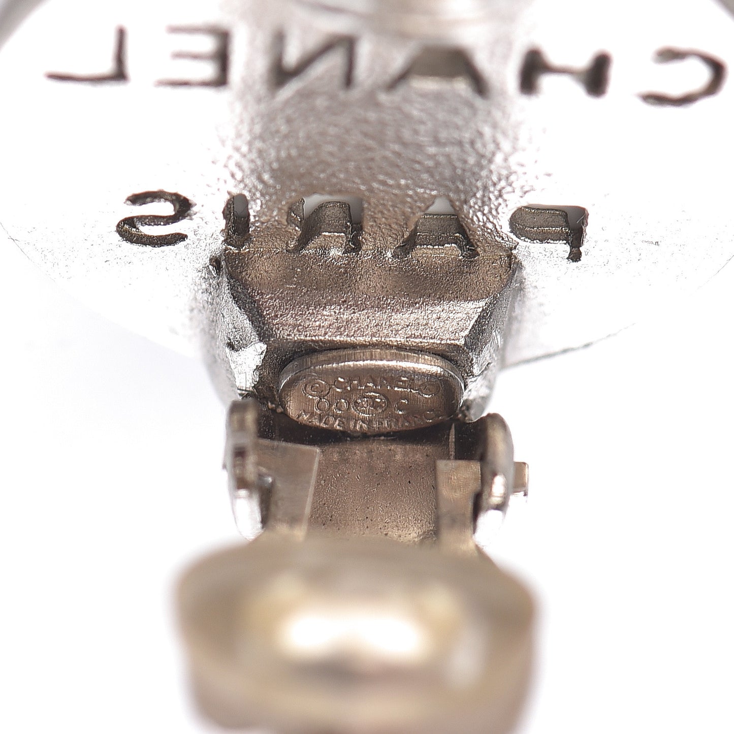 CHANE Logo Cutout Clip On Earrings Silver