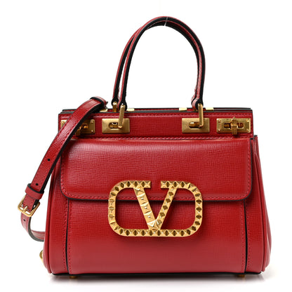 Valentino Garavani Grainy Calfskin Mini Rockstud Alcove Top-Handle Bag Rouge Pur 1 of 13