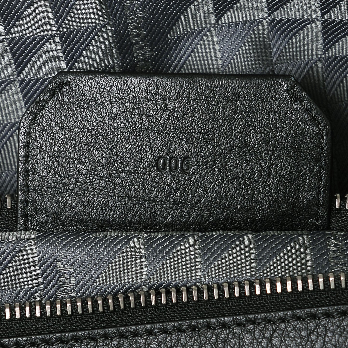Calfskin Triangle Embossed Travel Bag Black