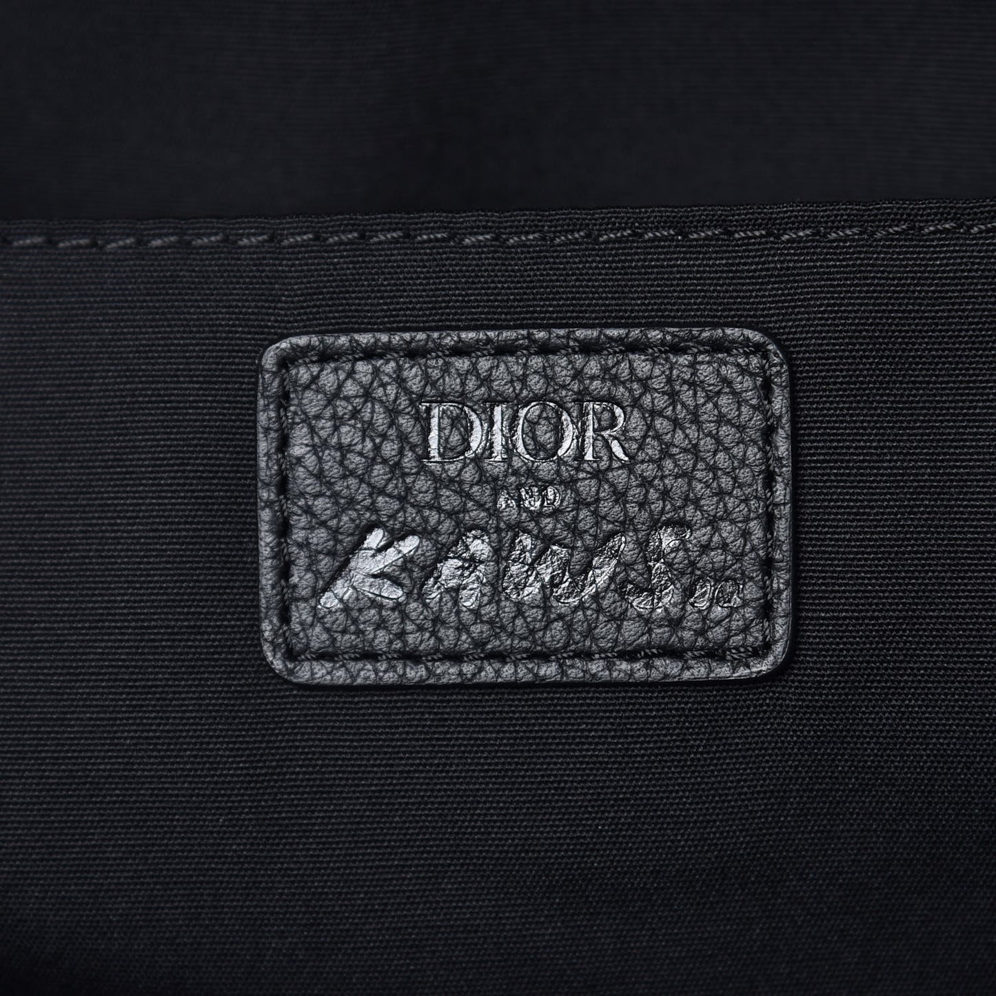 X KAWS Nylon Calfskin Logo Backpack Black