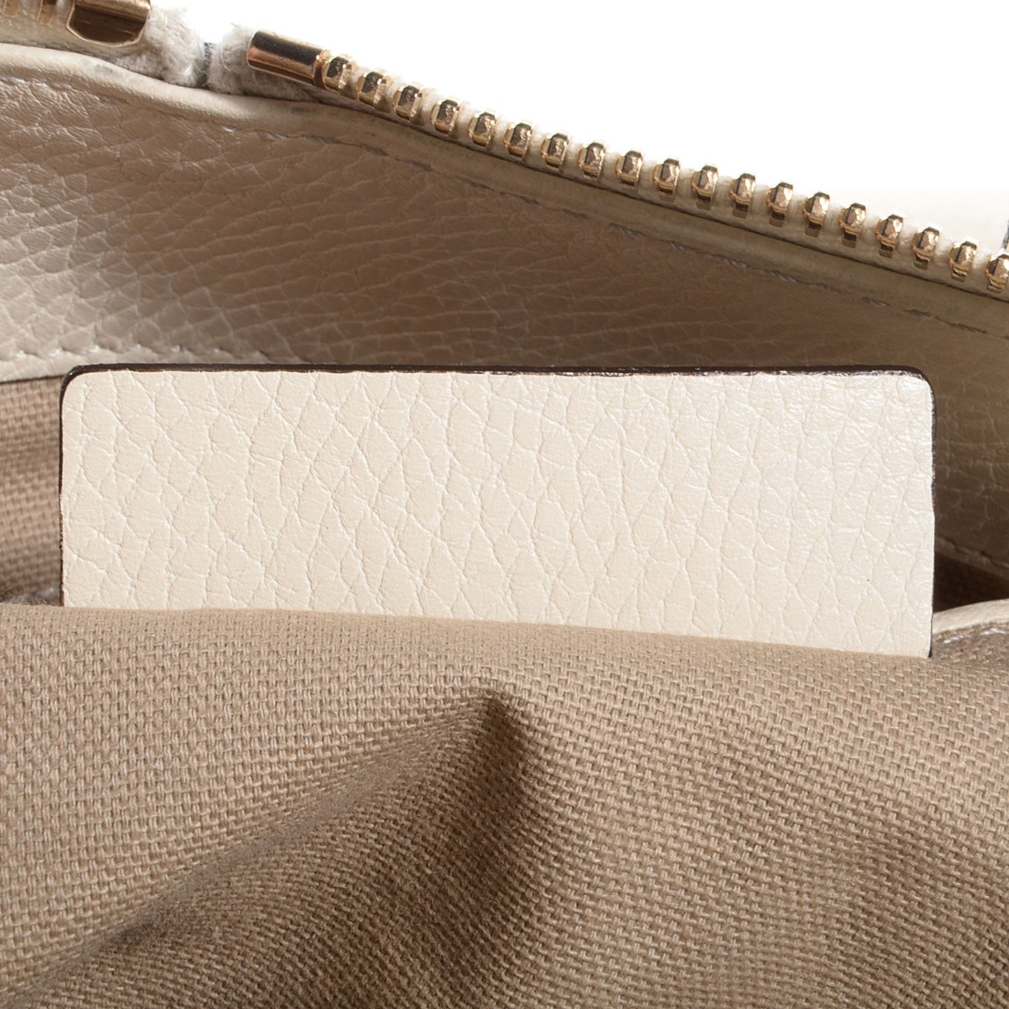 Pebbled Calfskin North South Skull Padlock Tote Bone