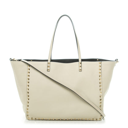 Valentino Garavani Grained Calfskin Medium Rockstud Reversible Tote Black Ivory 1 of 7