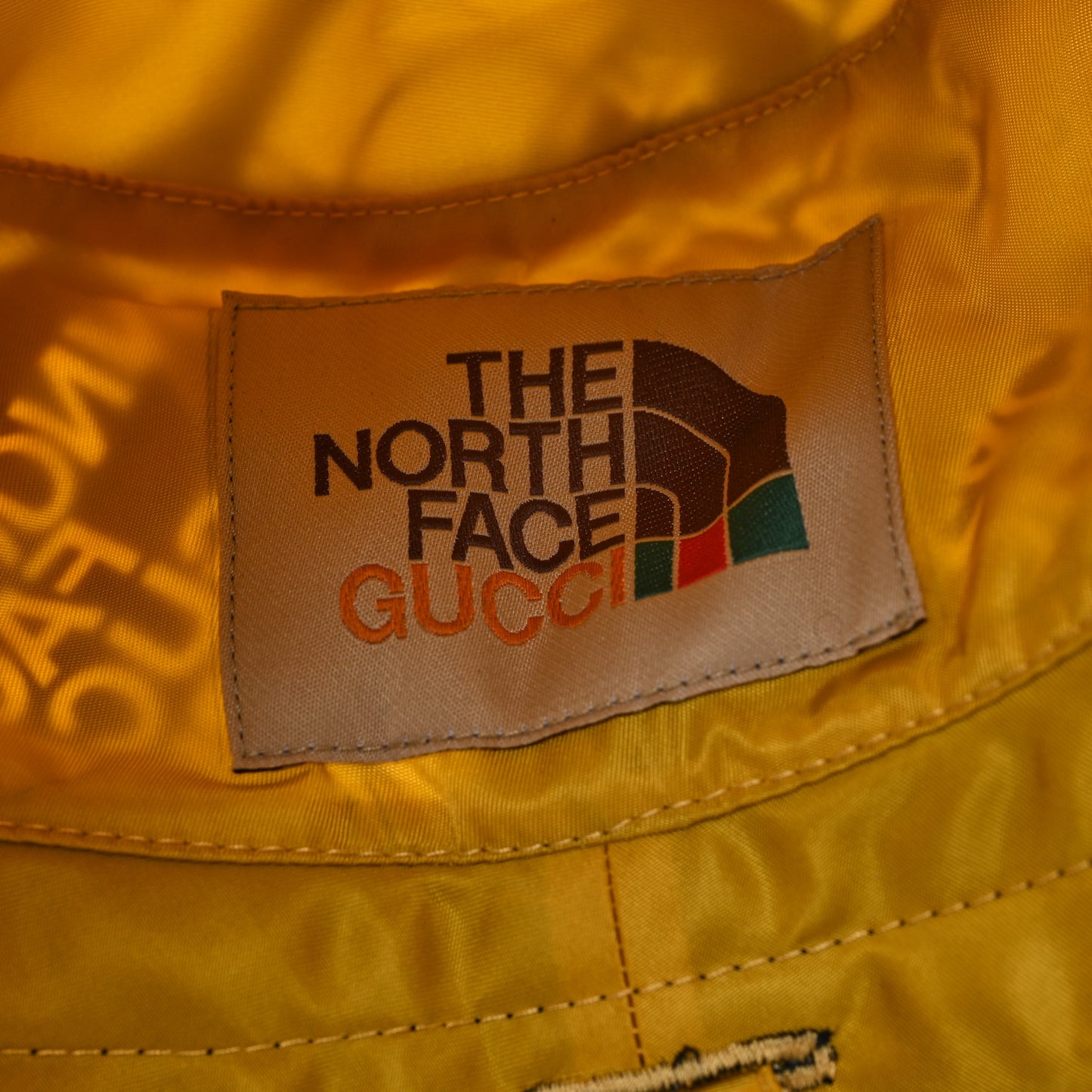X THE NORTH FACE Nylon Reversible Self-Tie Bucket Hat Black Yellow