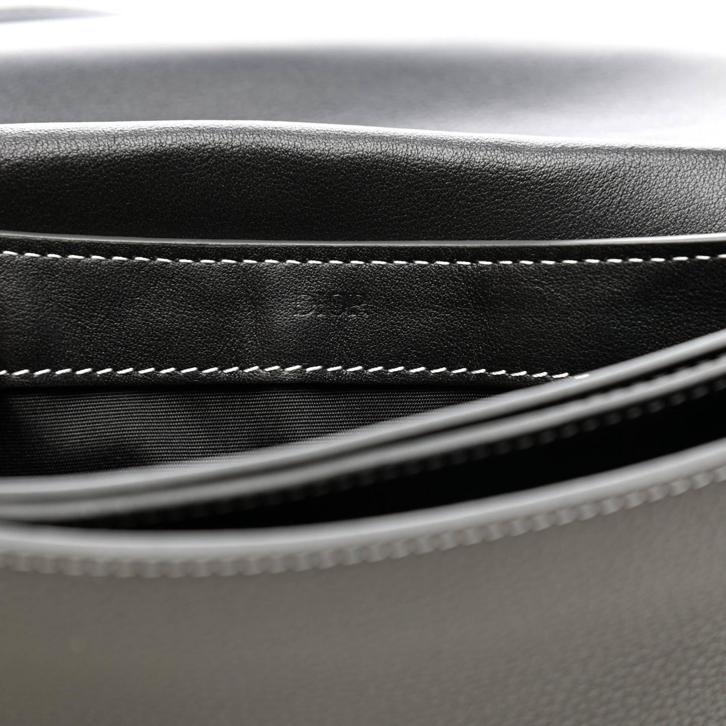 X KAWS Grained Calfskin Saddle Wristlet Grey