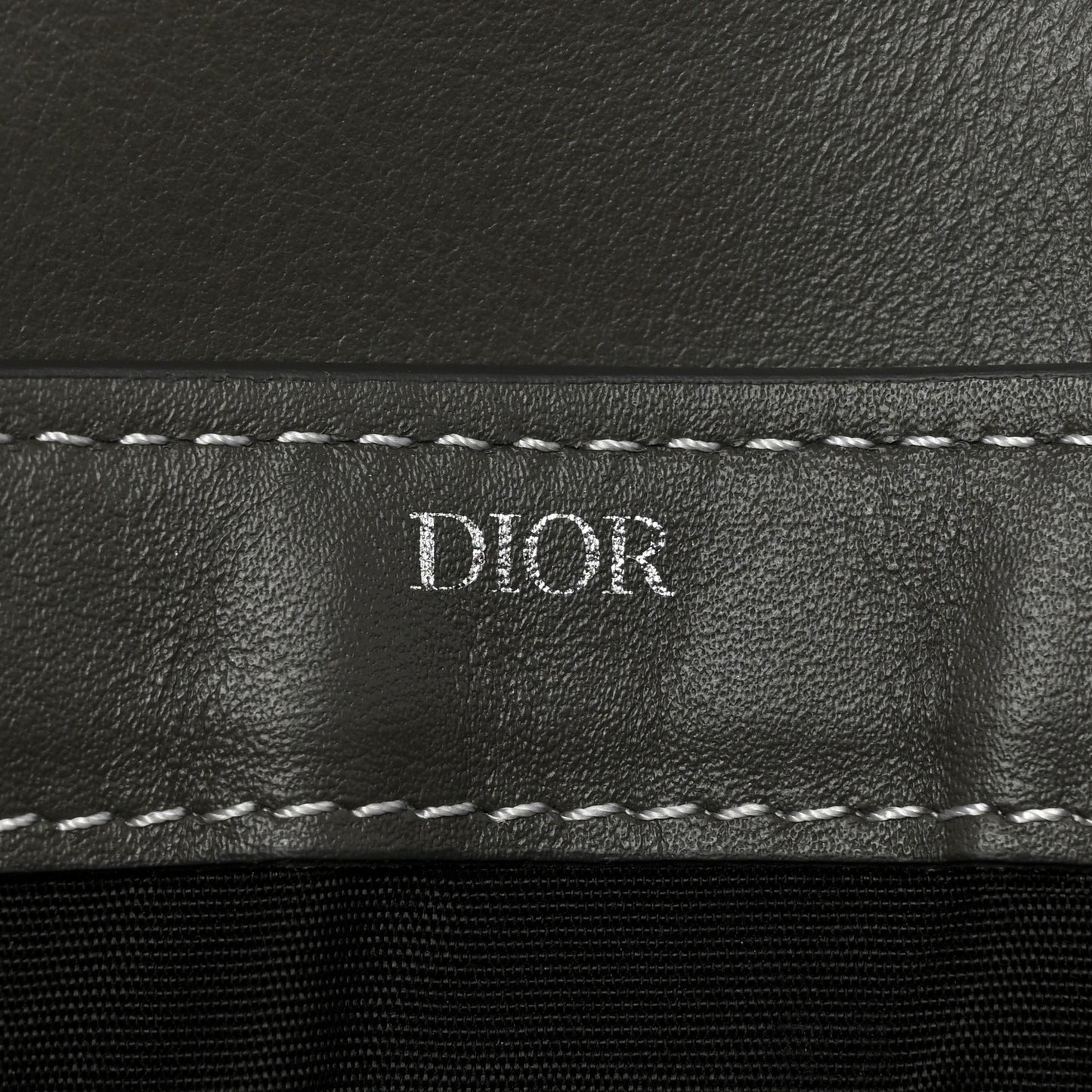 X KAWS Grained Calfskin Saddle Wristlet Grey