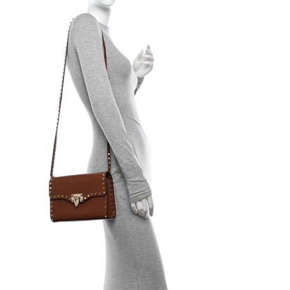 Valentino Garavani Pebbled Calfskin Medium Rockstud Flip Lock Crossbody Bag Saddle Brown 2 of 11
