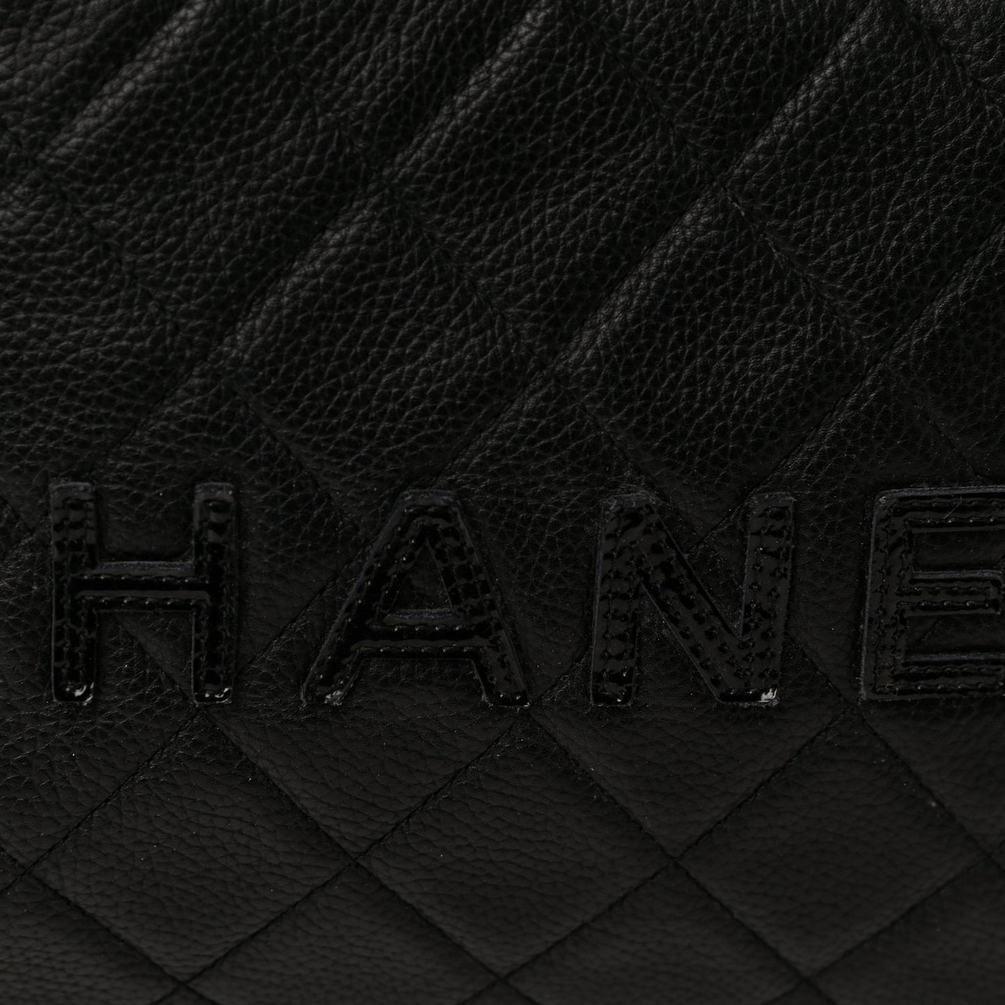 Caviar Patent Quilted Bowler Black