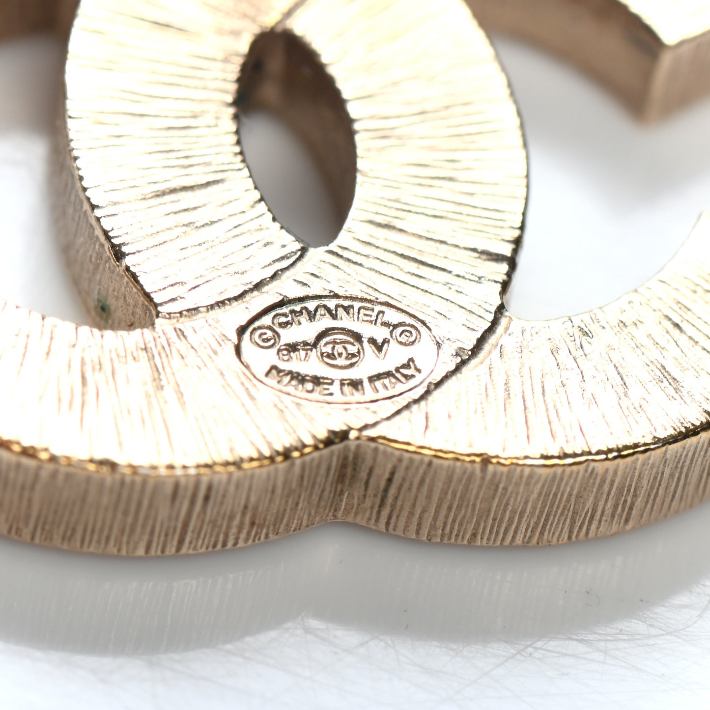 Metal Quilted CC Earrings Gold White