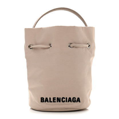 Balenciaga Recycled Sport Nylon Logo Embroidered Wheel Drawstring Bucket Bag Cream Black 1 of 9