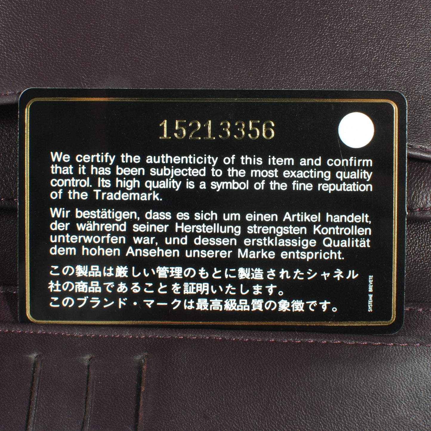 Lambskin Quilted Yen Wallet Plum