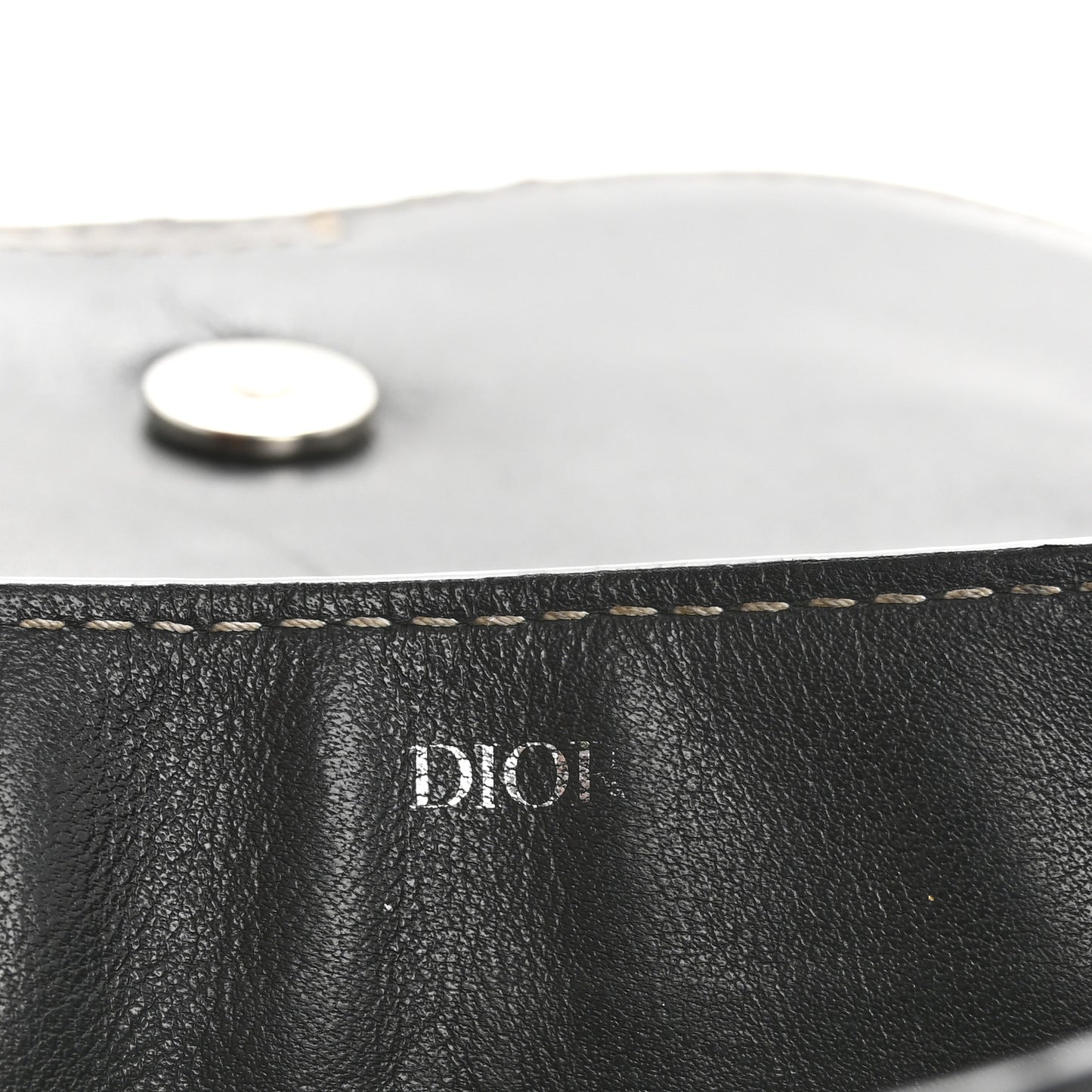 X KAWS Grained Calfskin Saddle Wristlet Black