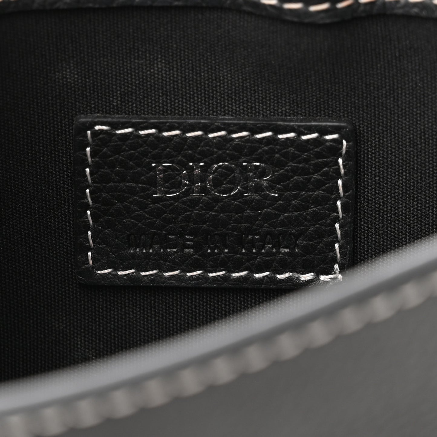 X KAWS Grained Calfskin Saddle Pouch Black