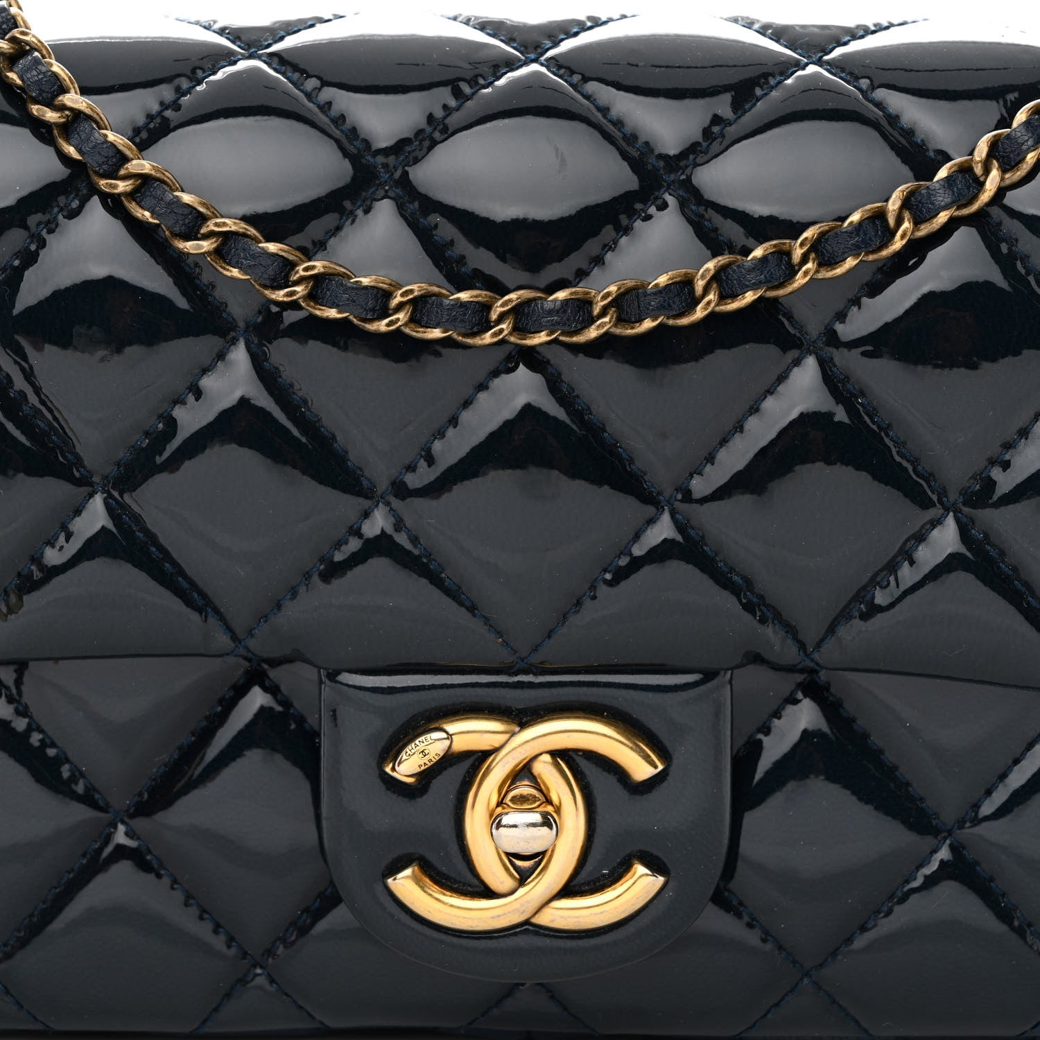 close up image of chanel patent leather in dark blue by FASHIONPHILE