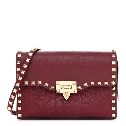 Valentino Garavani Pebbled Calfskin Medium Rockstud Flip Lock Crossbody Bag Rubin 1 of 10