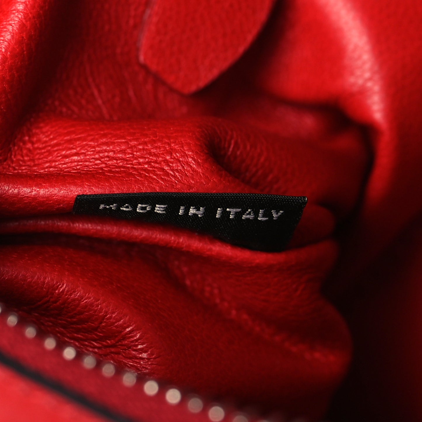 Soft Calfskin Studded Zip Clutch Fuoco