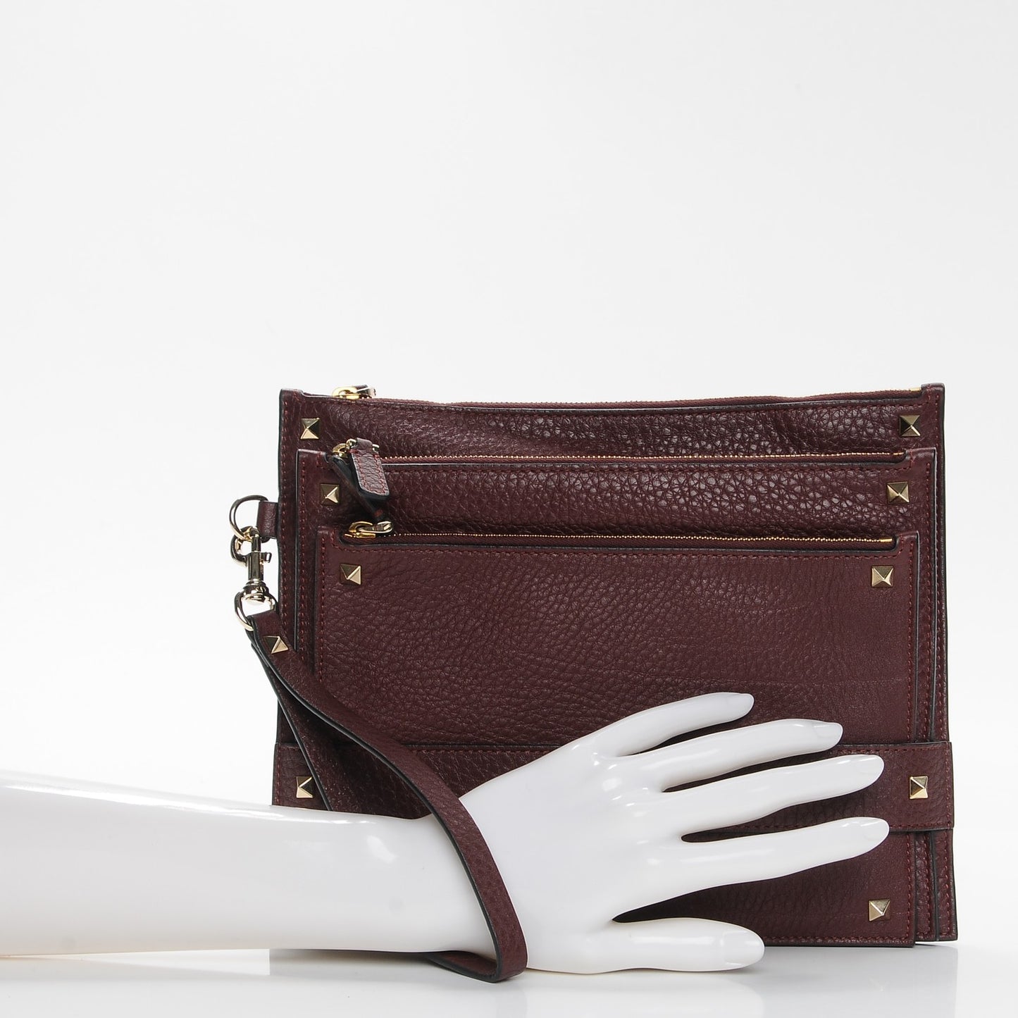 Pebbled Calfskin Rockstud Triple Zip Wristlet Pouch Burgundy