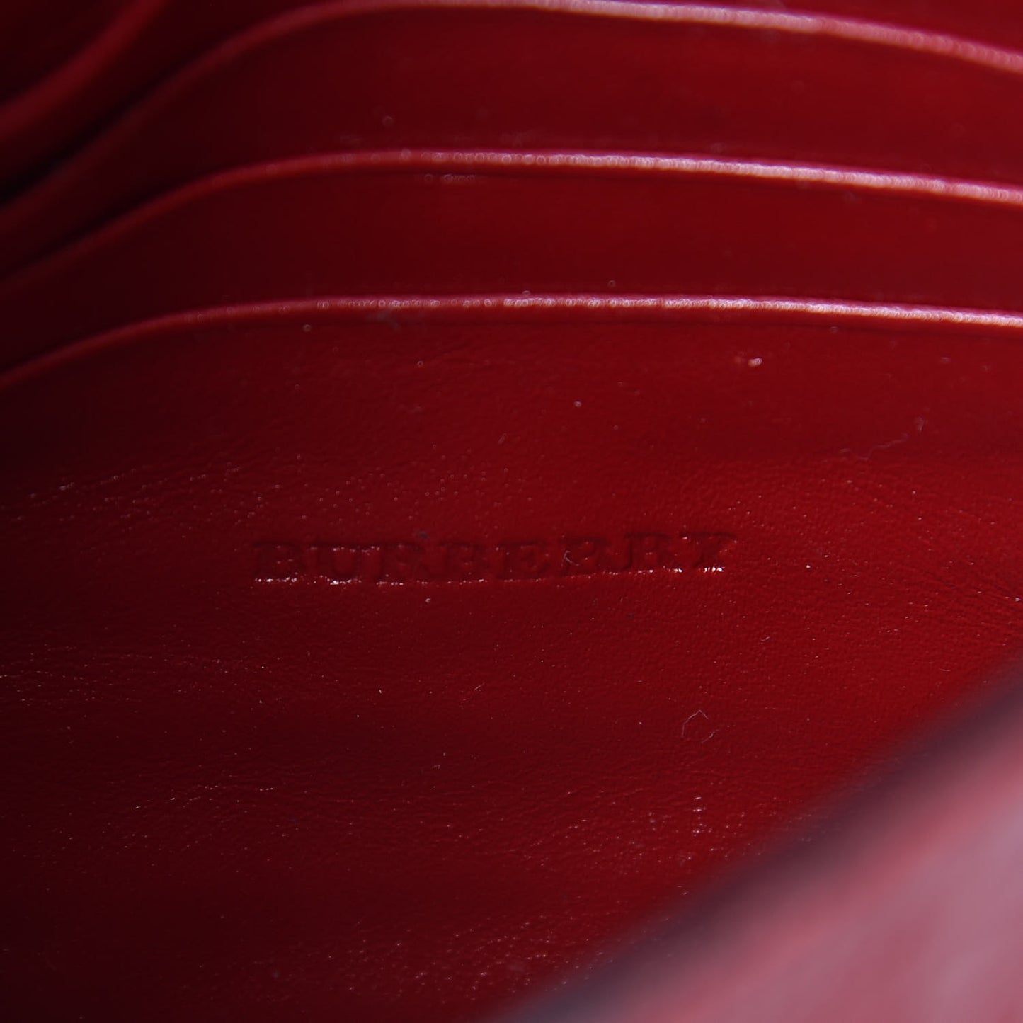 Signature Grain Calfskin Check Embossed Langley Crossbody Military Red
