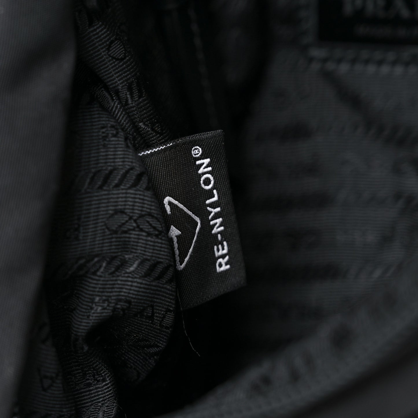 Re-Nylon Vitello Metal Triangle Logo Sling Backpack Black