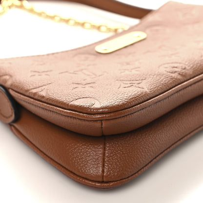 Louis Vuitton Empreinte Monogram Liv Pochette Cognac 9 of 11