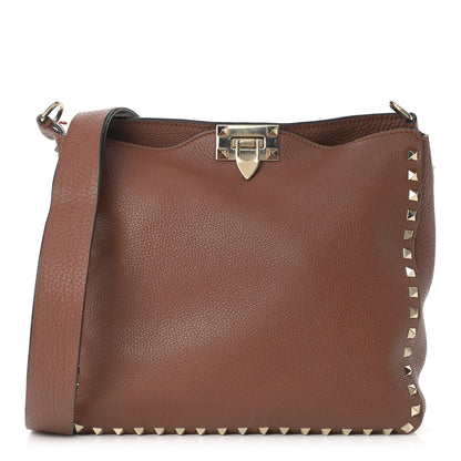 Valentino Garavani Pebbled Calfskin Small Rockstud Flip-Lock Messenger Bag Bright Cognac 1 of 13