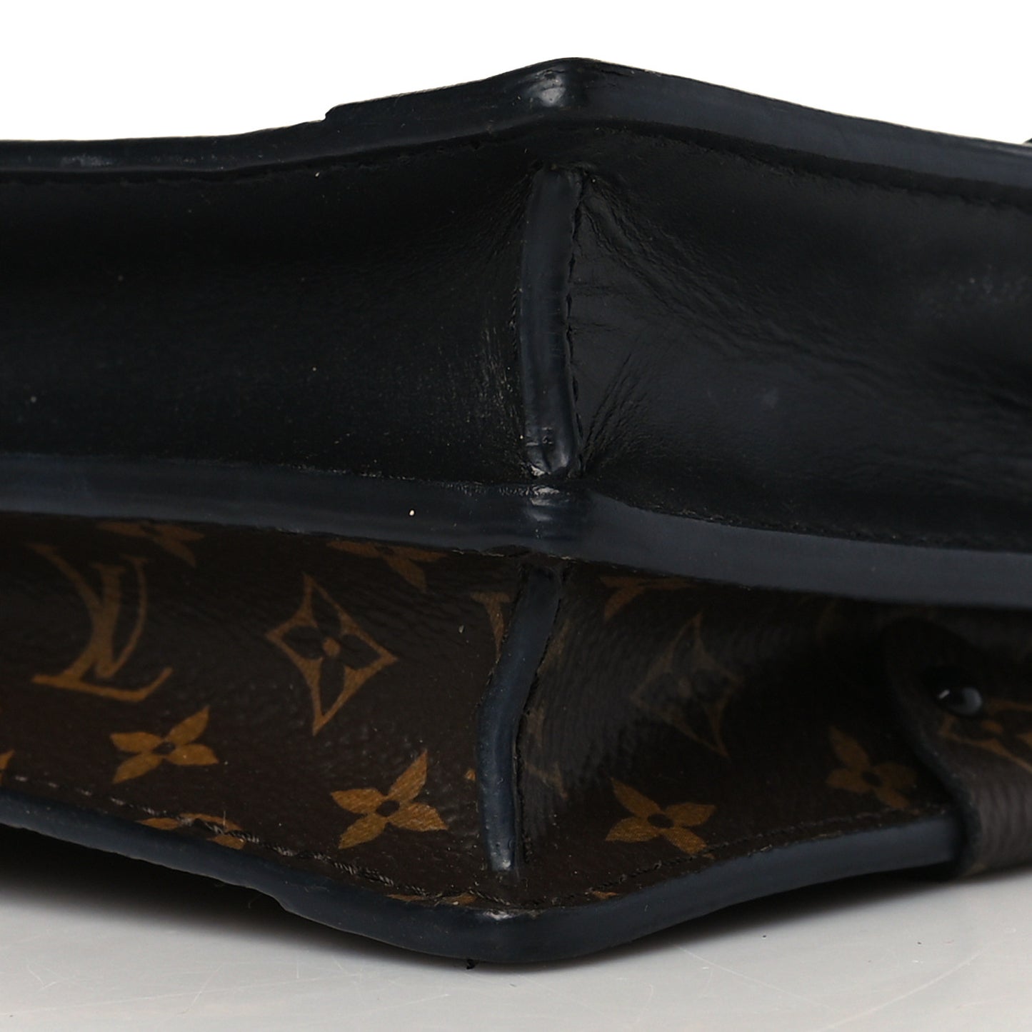 Reverse Monogram Trunk Clutch