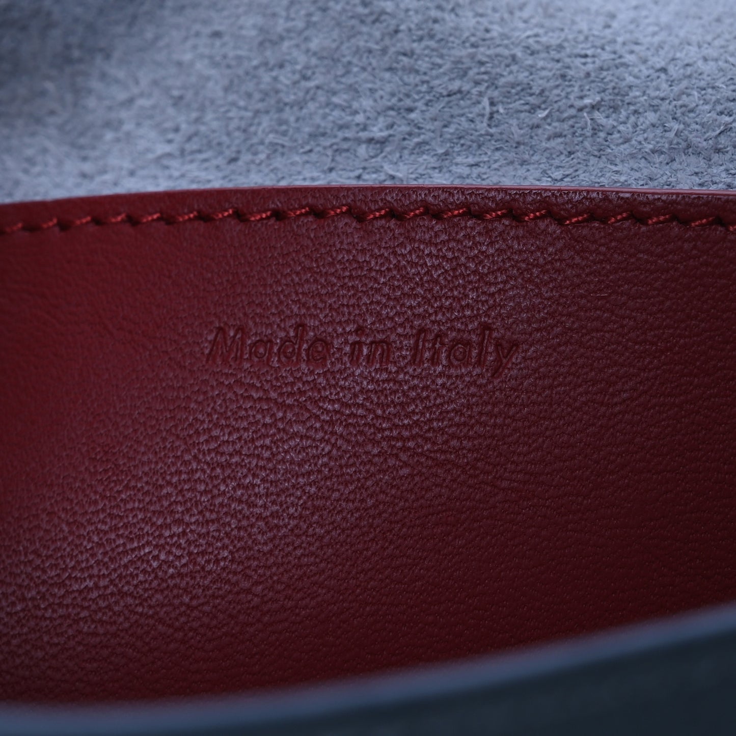 Grained Shiny Calfskin Strap Clutch Blue Red