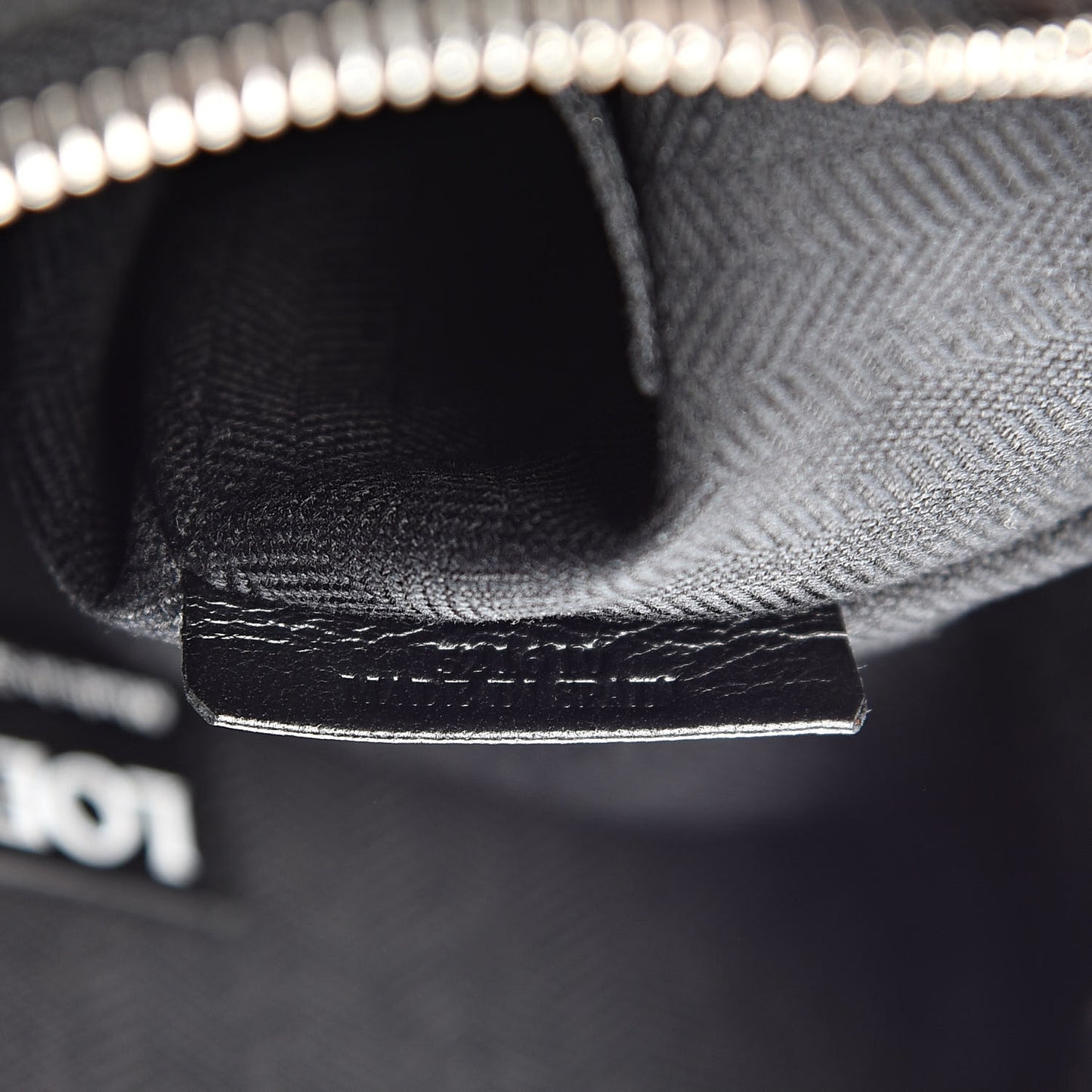 Calfskin Embossed Repeat T Pouch Black