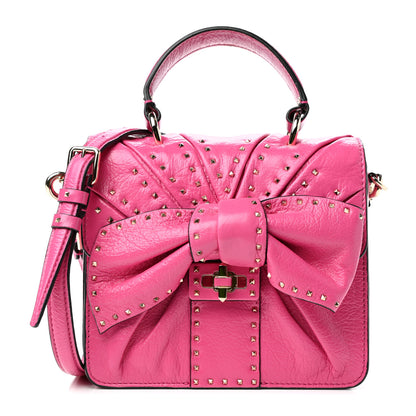 Valentino Garavani Pebbled Calfskin Rockstud Bow Top Handle Bag Pink Orchid 1 of 9